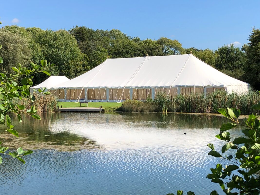 Traditional canvas wedding marquee hire in Hampshire with timber poles