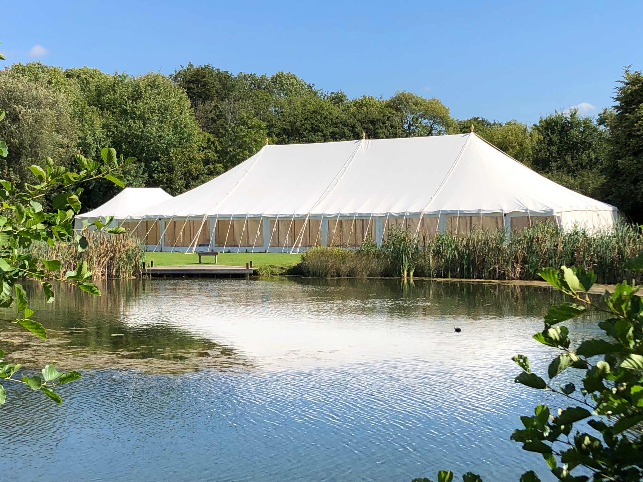 Traditional canvas wedding marquee hire in Hampshire with timber poles